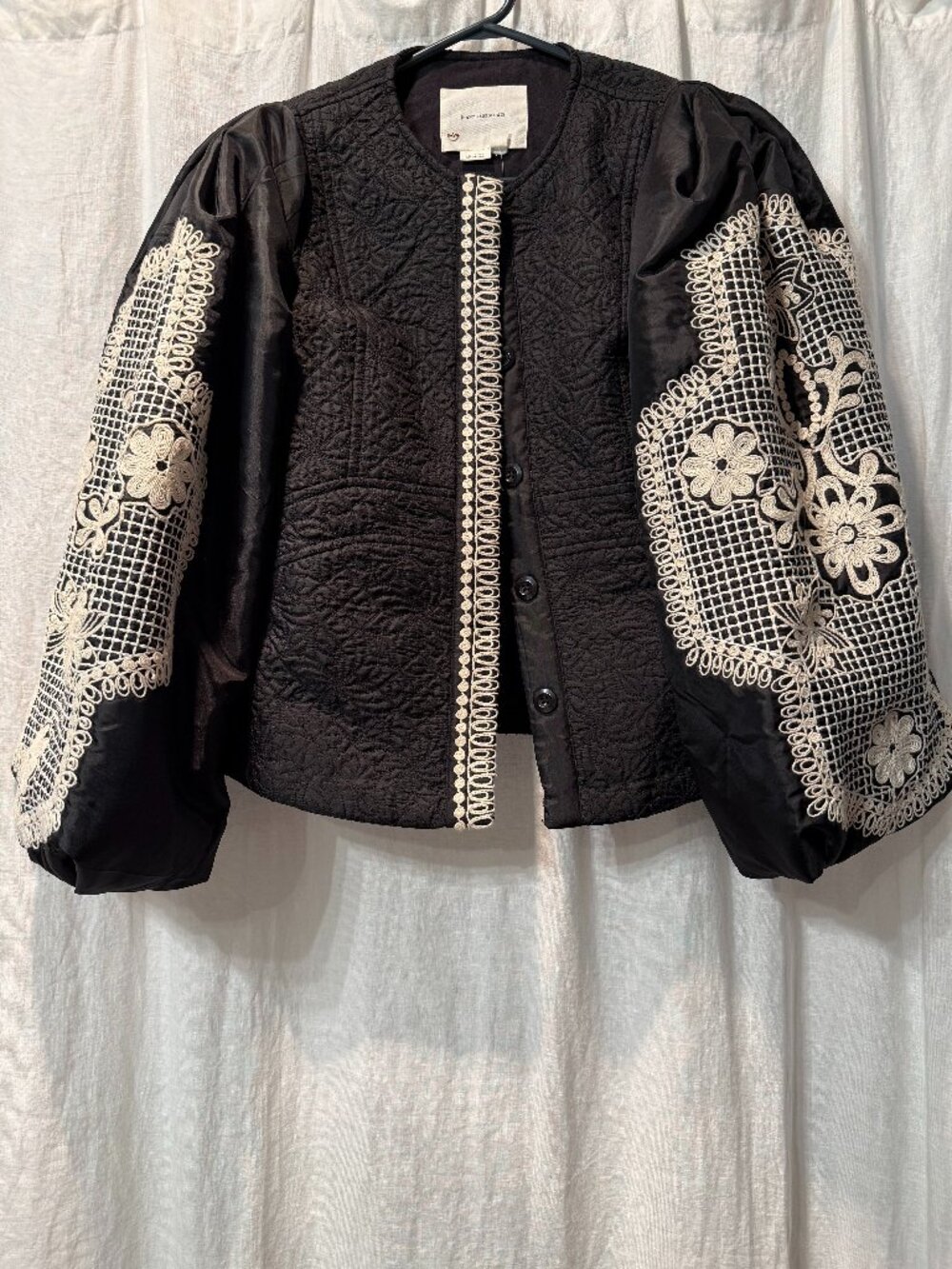 Embroidered black and white puffed sleeve jacket. New with tags